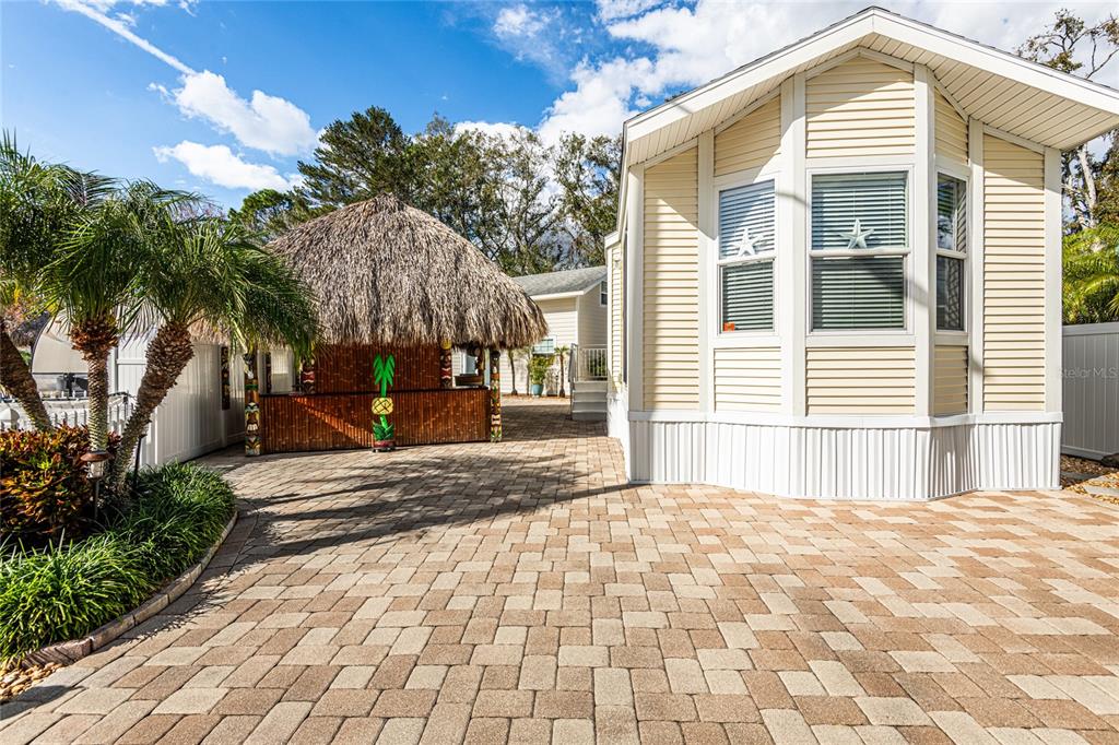 20300 Leonard Road, Unit 33 Lutz, FL 33558 - Photo 2 of 36 a front view of a house with a yard