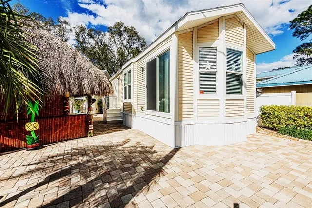 a view of a house with snow on the road