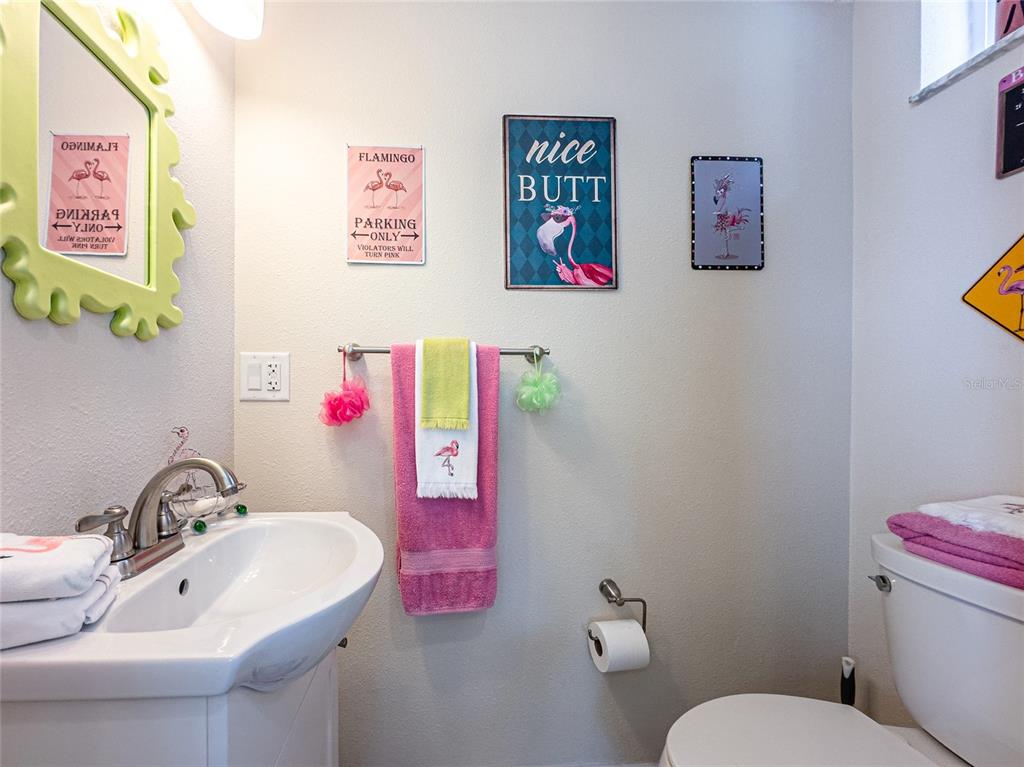 20300 Leonard Road, Unit 33 Lutz, FL 33558 - Photo 25 of 36 a bathroom with a sink mirror and toilet