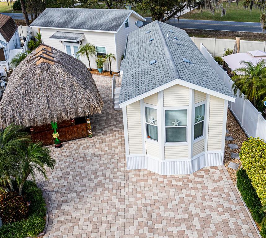 20300 Leonard Road, Unit 33 Lutz, FL 33558 - Photo 3 of 36 a view of a house with a yard