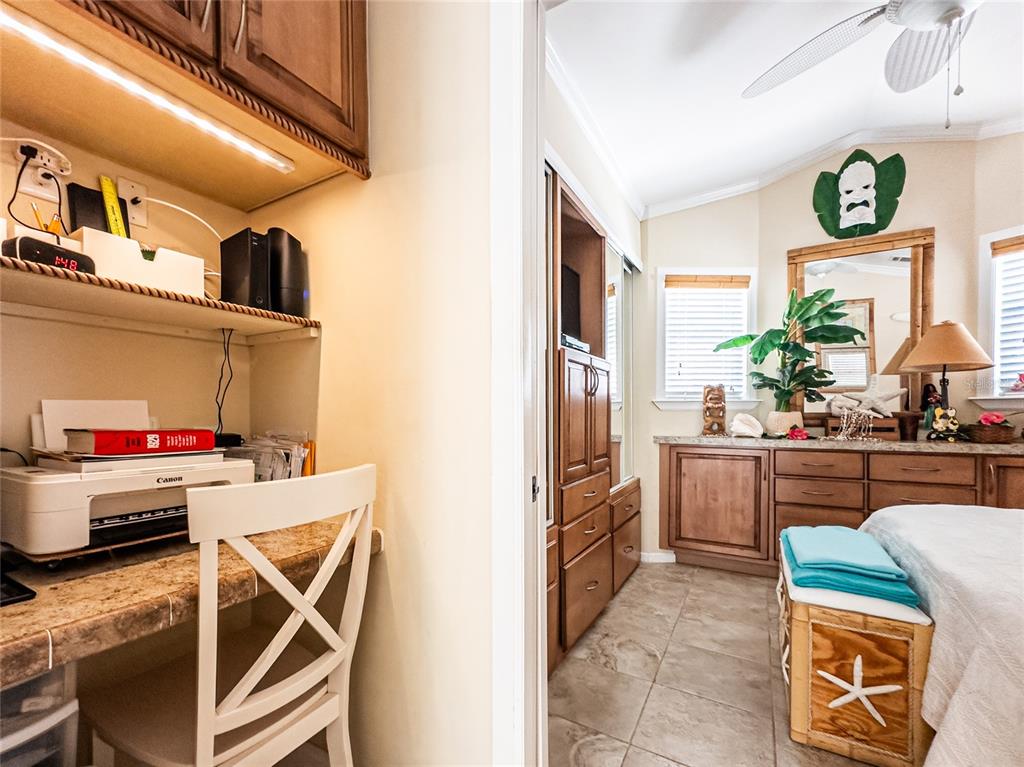 20300 Leonard Road, Unit 33 Lutz, FL 33558 - Photo 9 of 36 a kitchen with stainless steel appliances kitchen island granite countertop a refrigerator and a stove