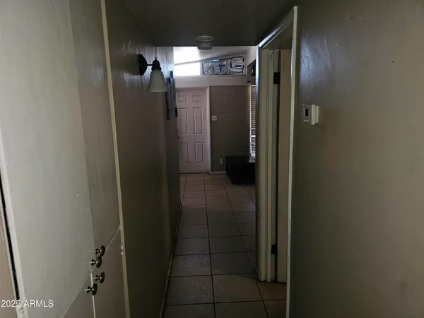 a bathroom with a toilet and a shower curtain