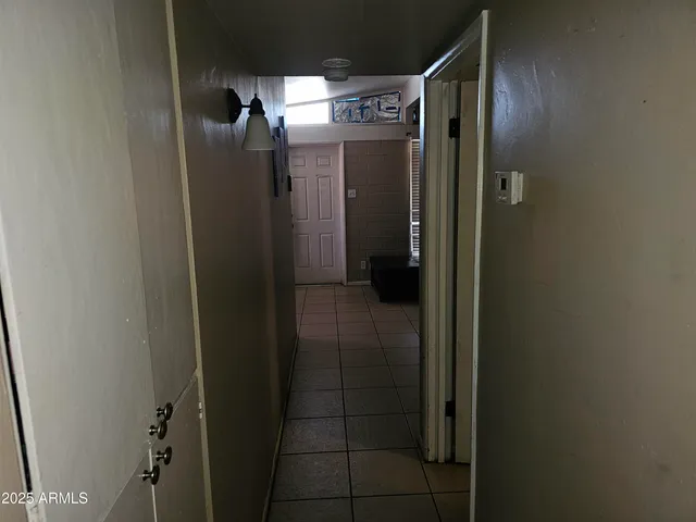 a bathroom with a toilet and a shower curtain