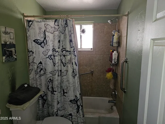 a view of a wooden door and a window