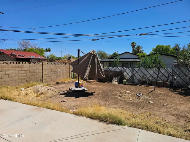 a view of a back yard of the house
