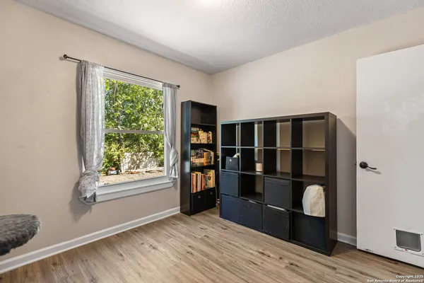 a bedroom with a bed and a dresser