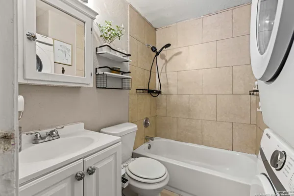a bathroom with a toilet and a bathtub