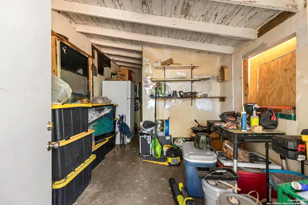 a view of a house with a yard covered in snow