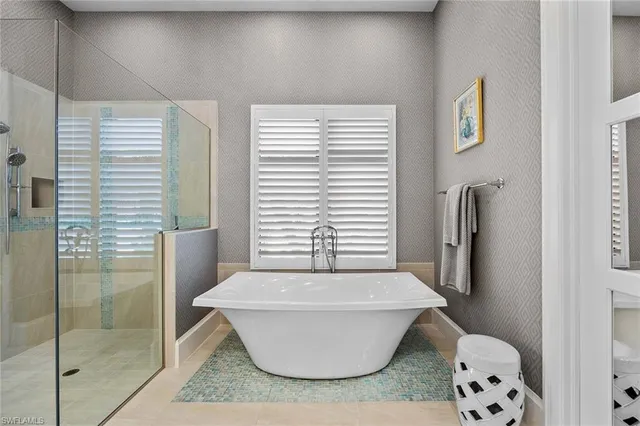 a bathroom with a bathtub and toilet