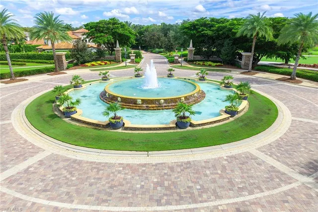 a view of a swimming pool with a yard