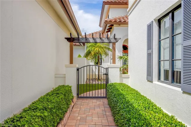 a view of a house with a flower garden