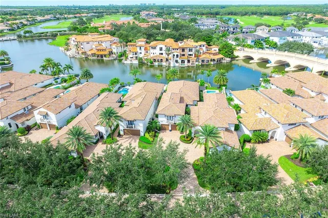an aerial view of a city with lake view