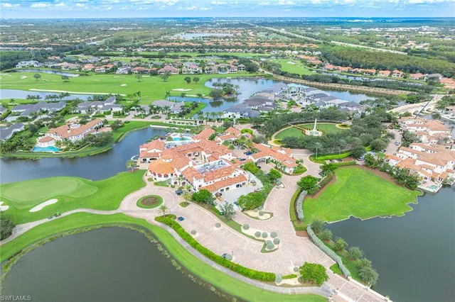 an aerial view of a residential houses with outdoor space