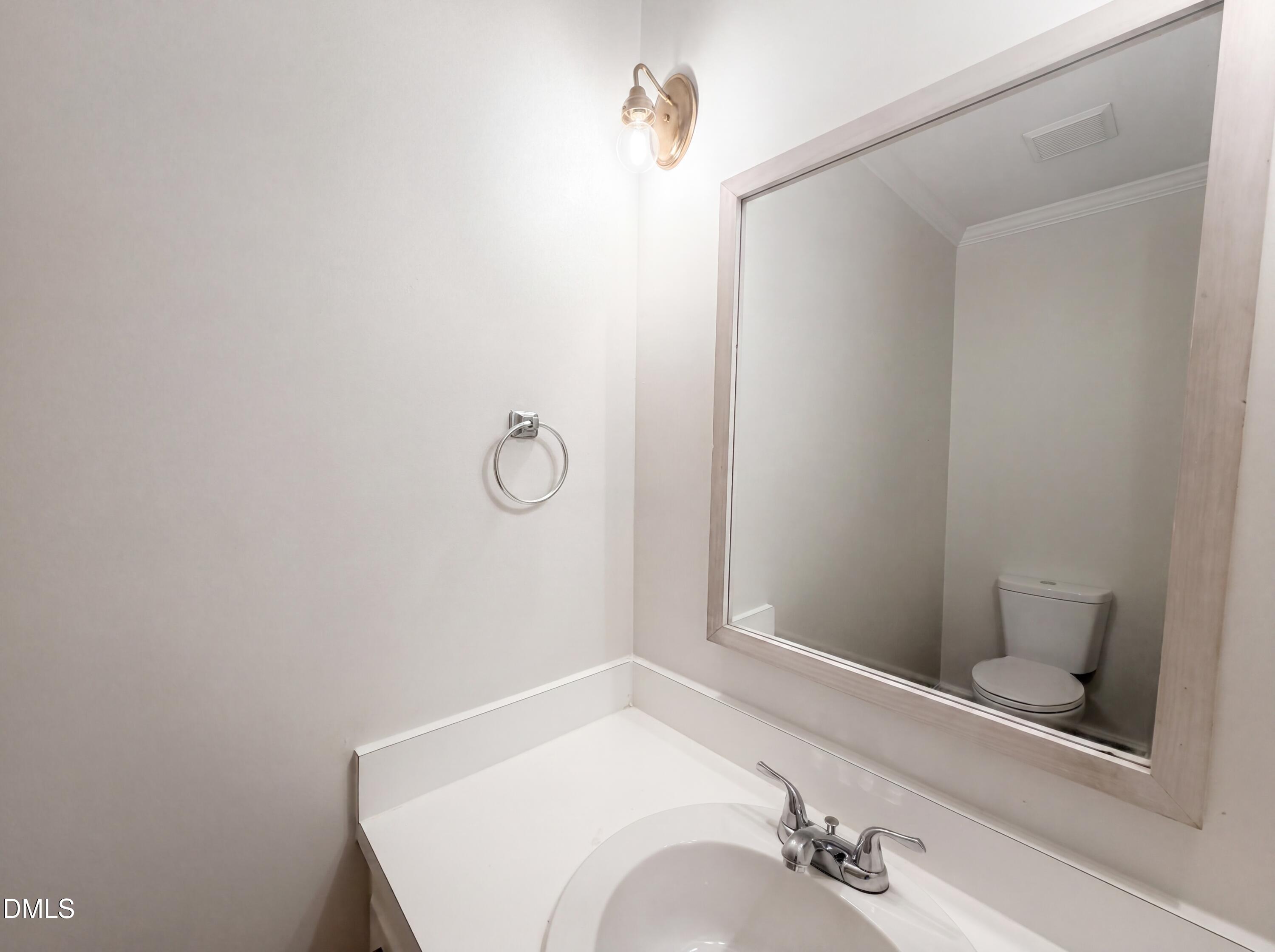 3921 Iron Horse Road Raleigh, NC 27616 - Photo 11 of 20 a bathroom with a sink and vanity