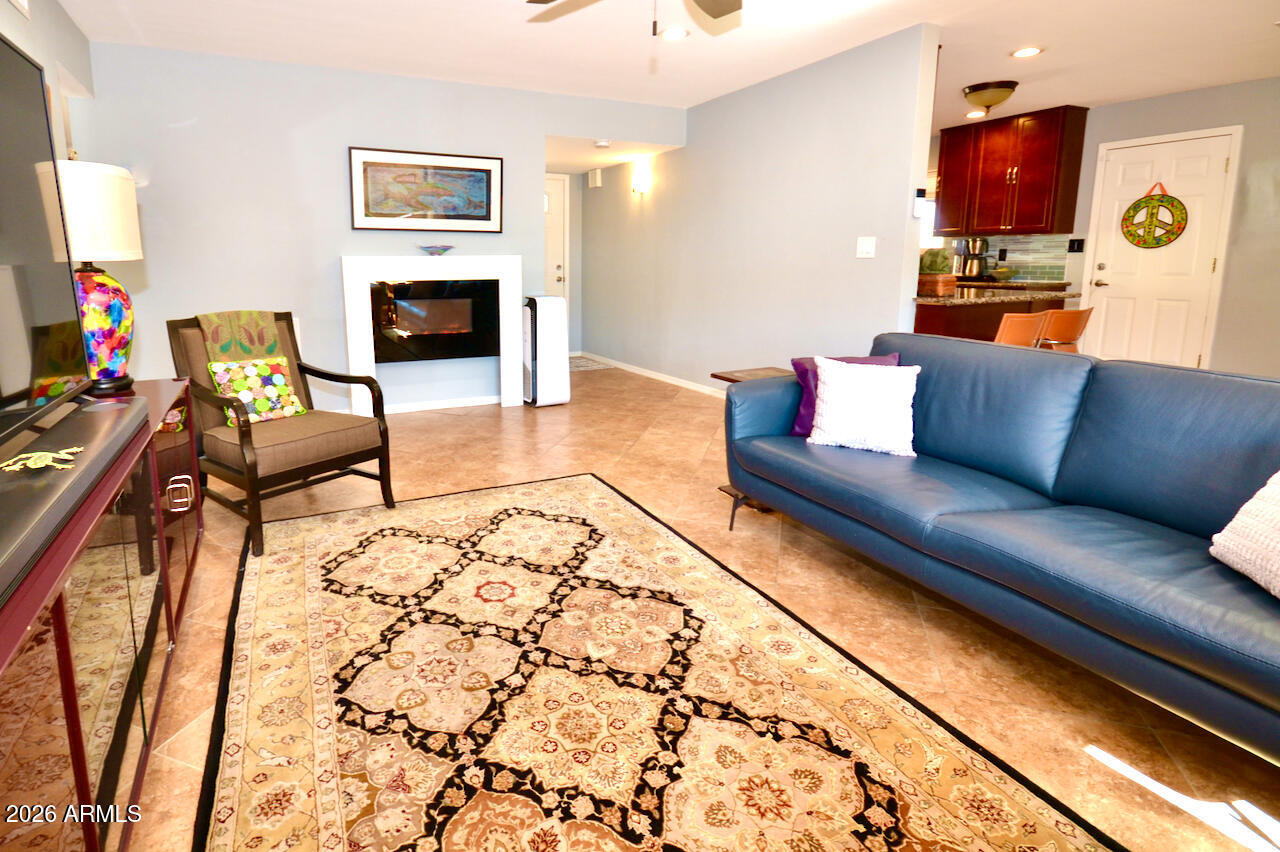 1215 West Colter Street Phoenix, AZ 85013 - Photo 23 of 41 a living room with furniture and a fireplace