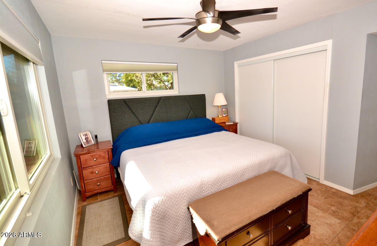 1215 West Colter Street Phoenix, AZ 85013 - Photo 24 of 41 a bedroom with a bed and a window
