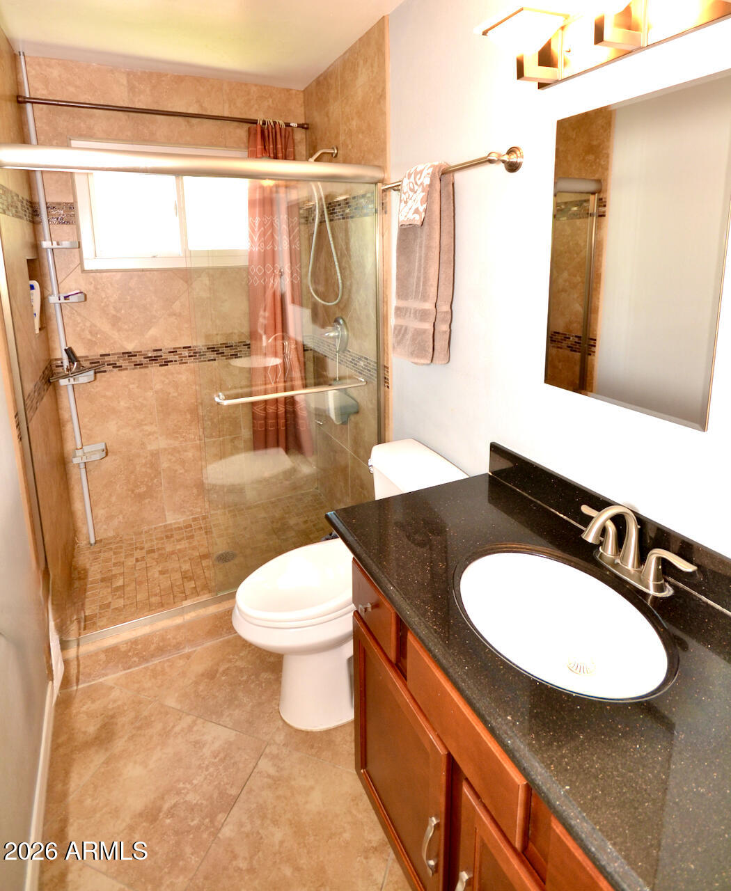 1215 West Colter Street Phoenix, AZ 85013 - Photo 25 of 41 a bathroom with a granite countertop toilet sink and mirror