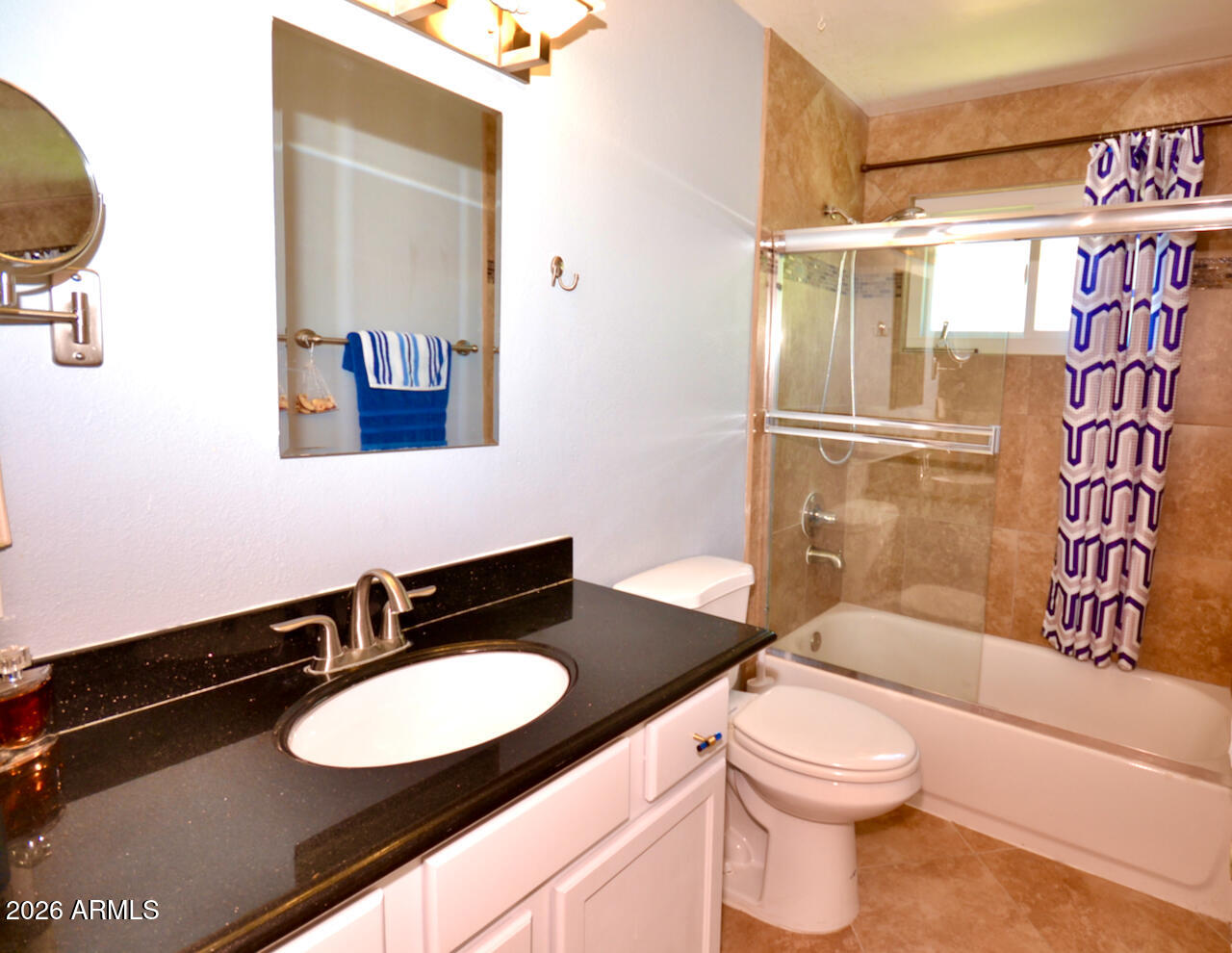 1215 West Colter Street Phoenix, AZ 85013 - Photo 28 of 41 a bathroom with a sink a toilet and shower