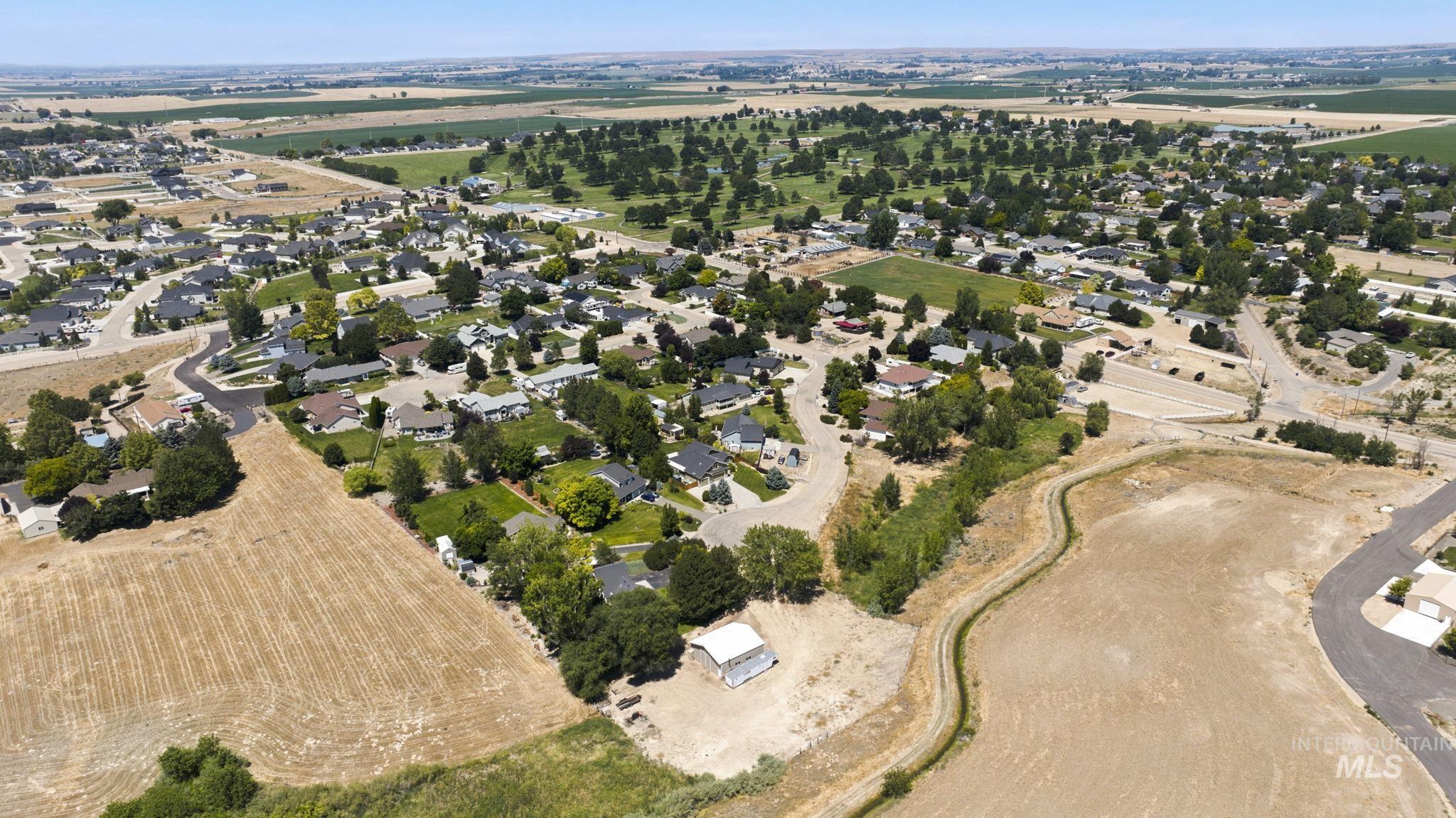 24864 Coventry Drive Caldwell, ID 83607 - Photo 37 of 49 Aerial overview showcasing residential developments, cultivated fields, and open land