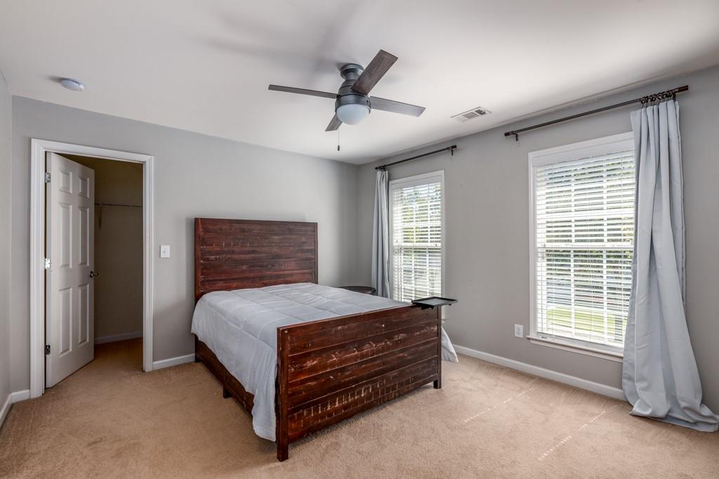 146 Edgewater Trail Canton, GA 30115 - Photo 14 of 25 a bedroom with a bed and a window