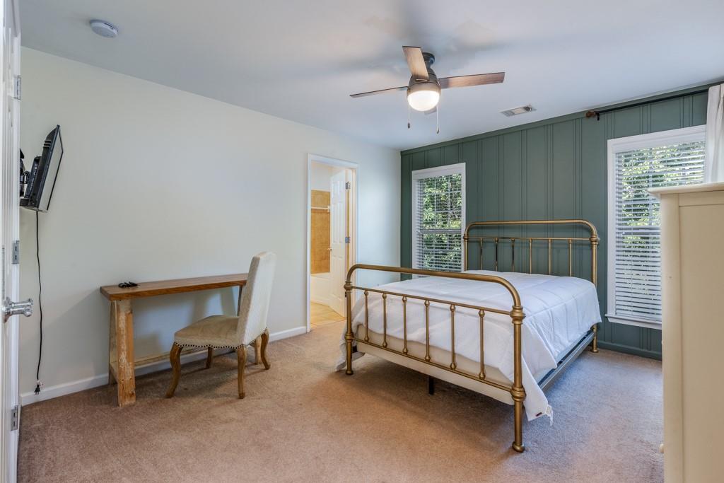 146 Edgewater Trail Canton, GA 30115 - Photo 16 of 25 a bedroom with a bed and a chandelier