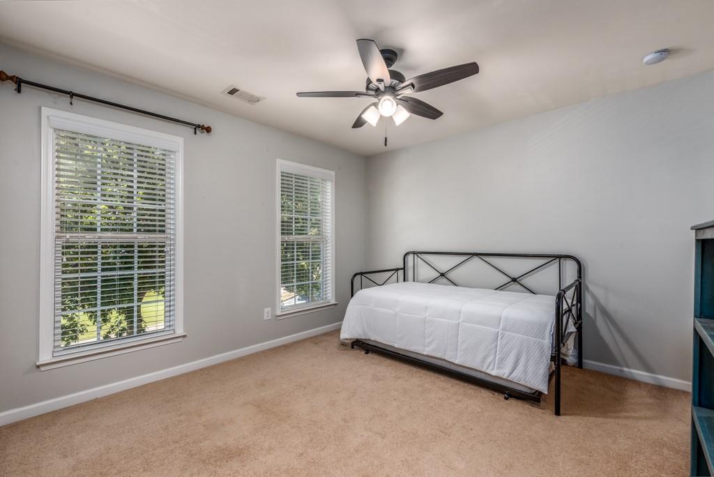 146 Edgewater Trail Canton, GA 30115 - Photo 18 of 25 a bedroom with a bed and window