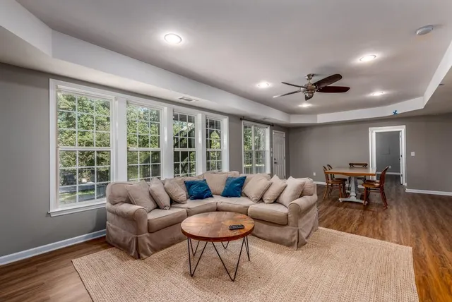 a living room with furniture and a large window