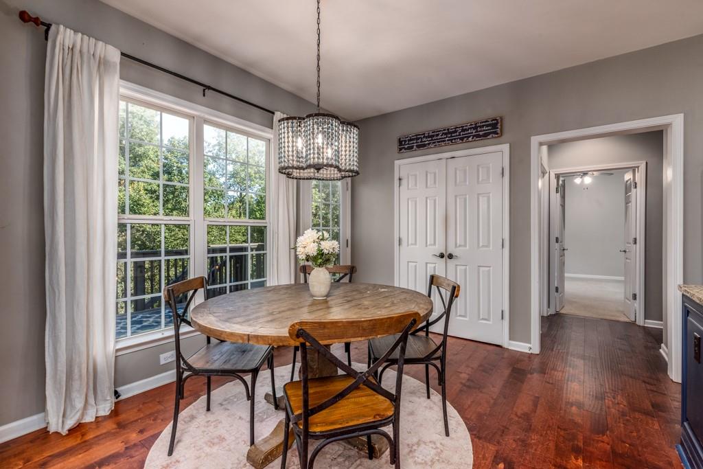 146 Edgewater Trail Canton, GA 30115 - Photo 8 of 25 a view of a dining room with furniture window and wooden floor