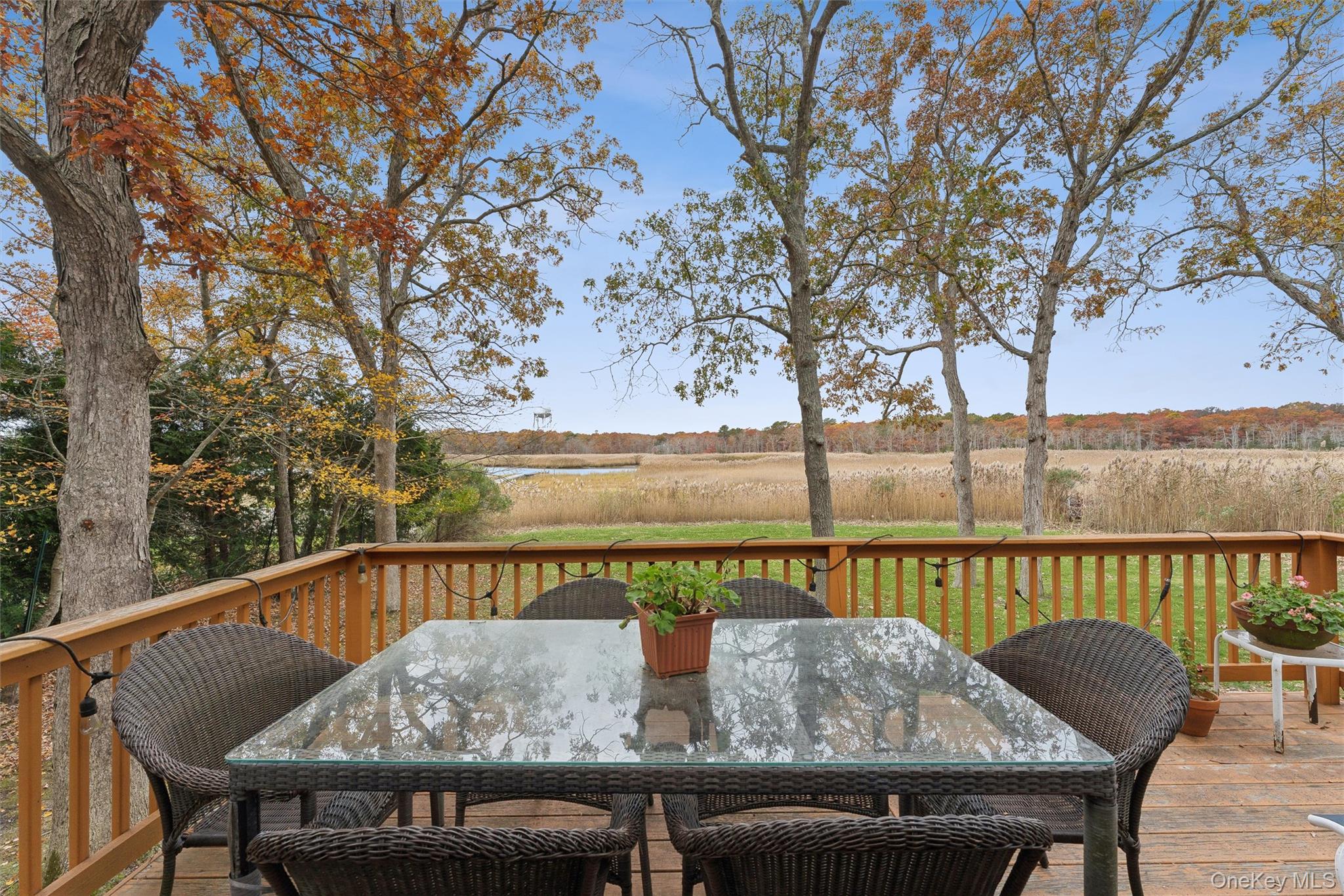 23 Old Main Road Quogue, NY 11959 - Photo 4 of 19 a view of sitting area with furniture and wooden deck