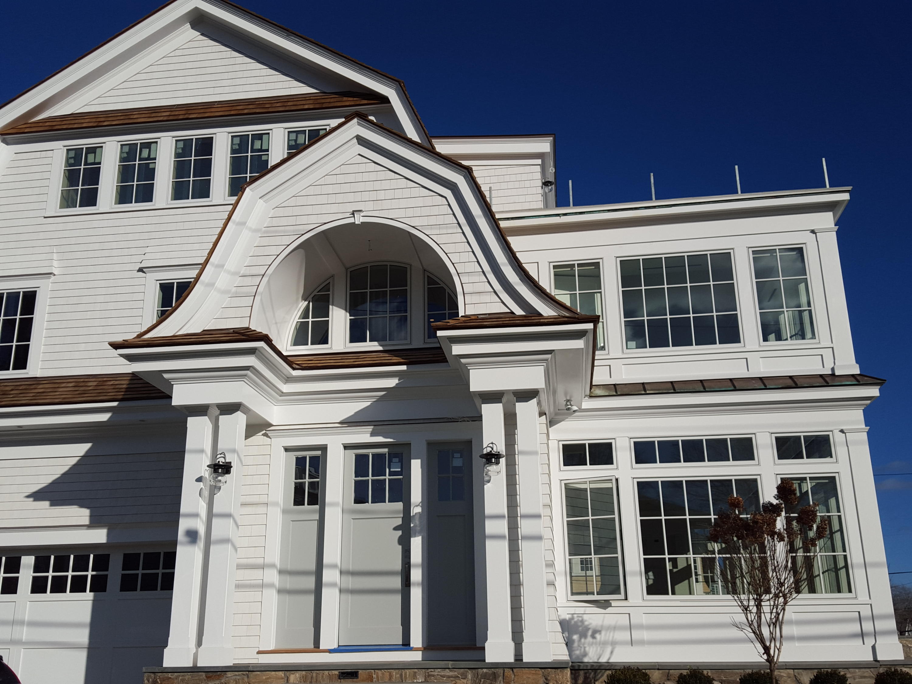 23 Crescent Beach Road Rowayton, CT 06853 - Photo 3 of 34 a front view of a house with a glass door