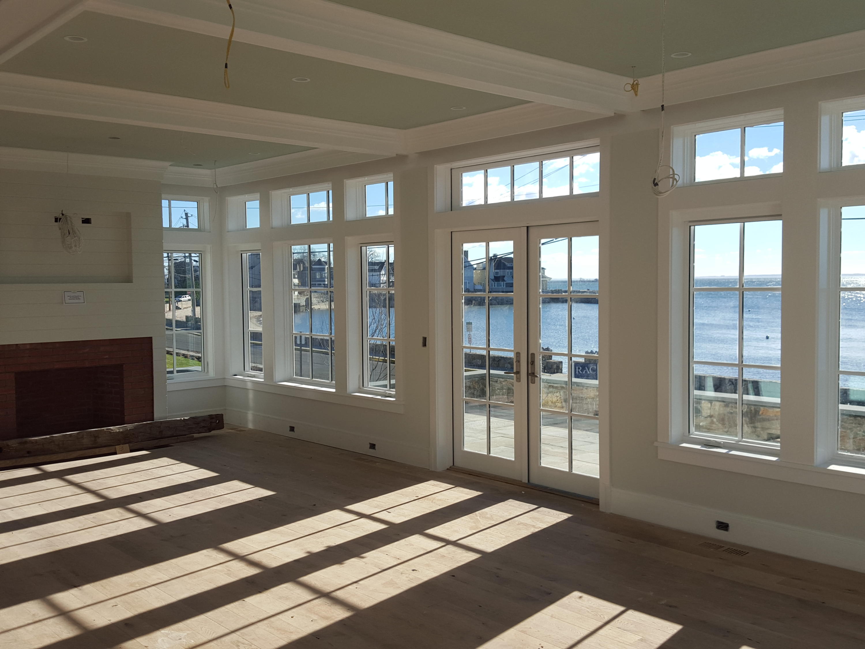 23 Crescent Beach Road Rowayton, CT 06853 - Photo 4 of 34 a living room with a bed furniture and next to a window