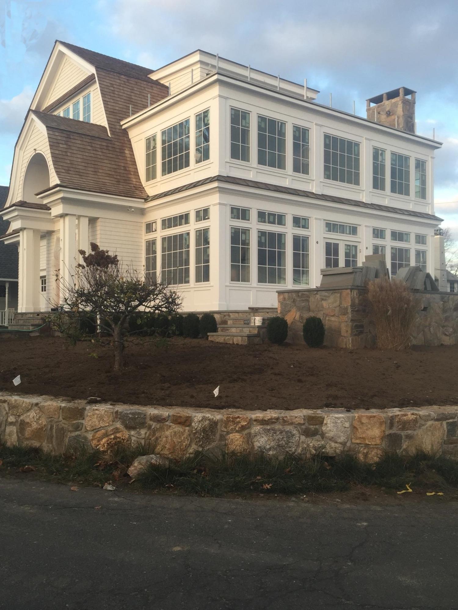 23 Crescent Beach Road Rowayton, CT 06853 - Photo 6 of 34 a front view of a house with a yard