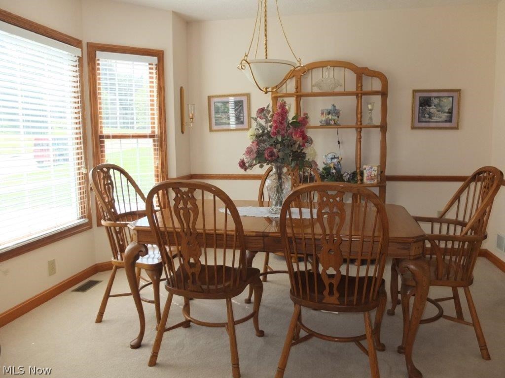 1151 Rolena Circle Northwest Canton, OH 44708 - Photo 4 of 20 Formal dining room with bay window and chair rail.