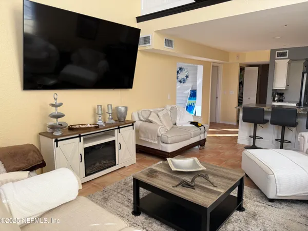 a bedroom with a bed and a fireplace