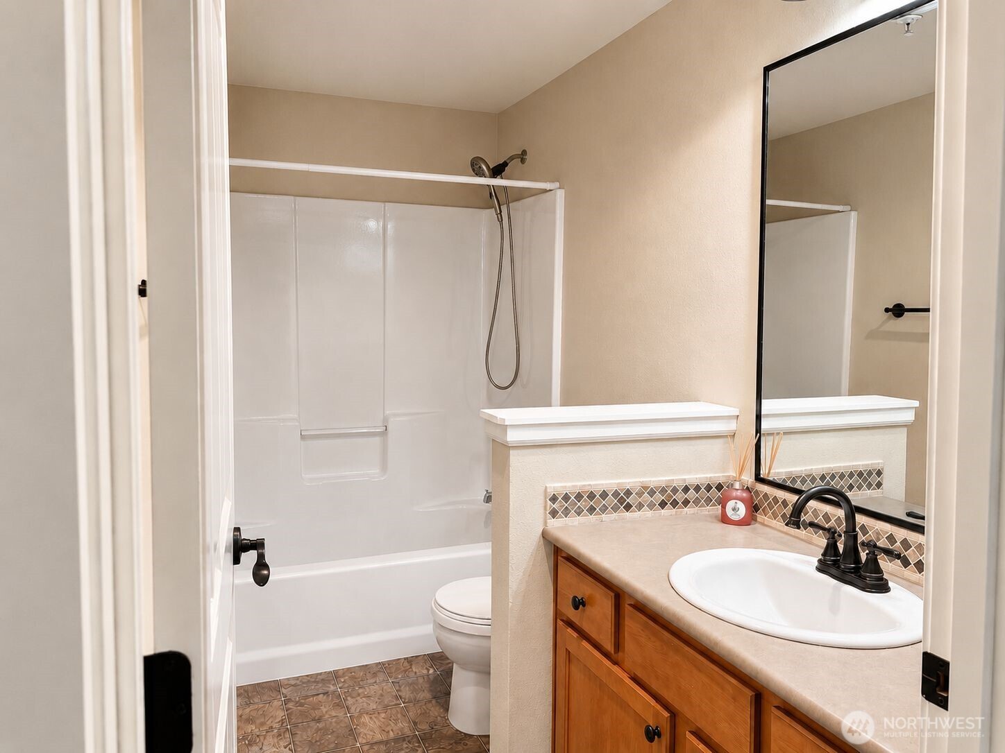 700 32nd Street, Unit A309 Bellingham, WA 98225 - Photo 18 of 28 a bathroom with a sink toilet vanity and shower