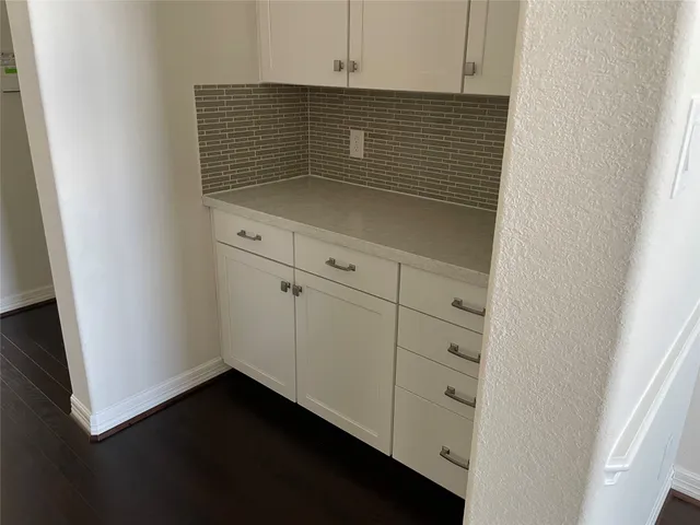 a view of livingroom with hardwood floor and hallway