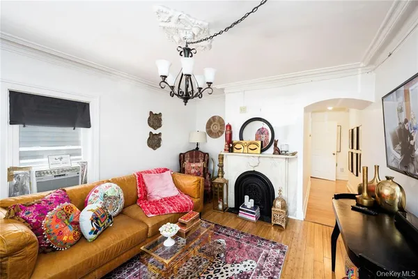 a living room with furniture fireplace and flat screen tv