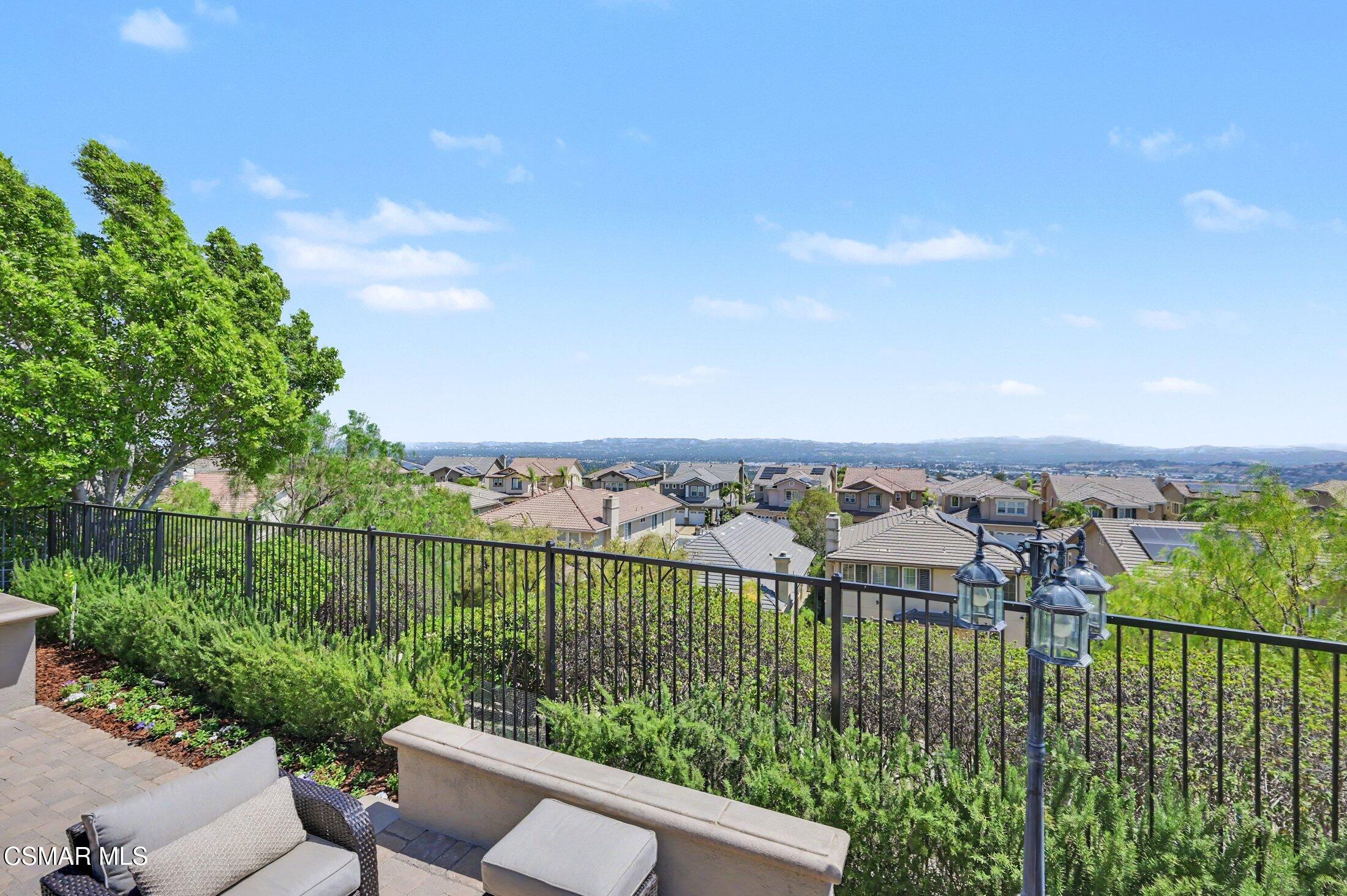 20800 Sardinia Way Porter Ranch, CA 91326 - Photo 50 of 57 a view of a balcony with a yard