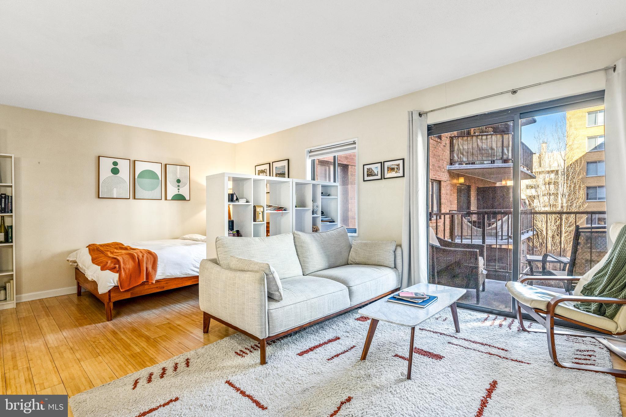1718 P Street Northwest, Unit 509 Washington, DC 20036 - Photo 11 of 20 a living room with furniture and a large window