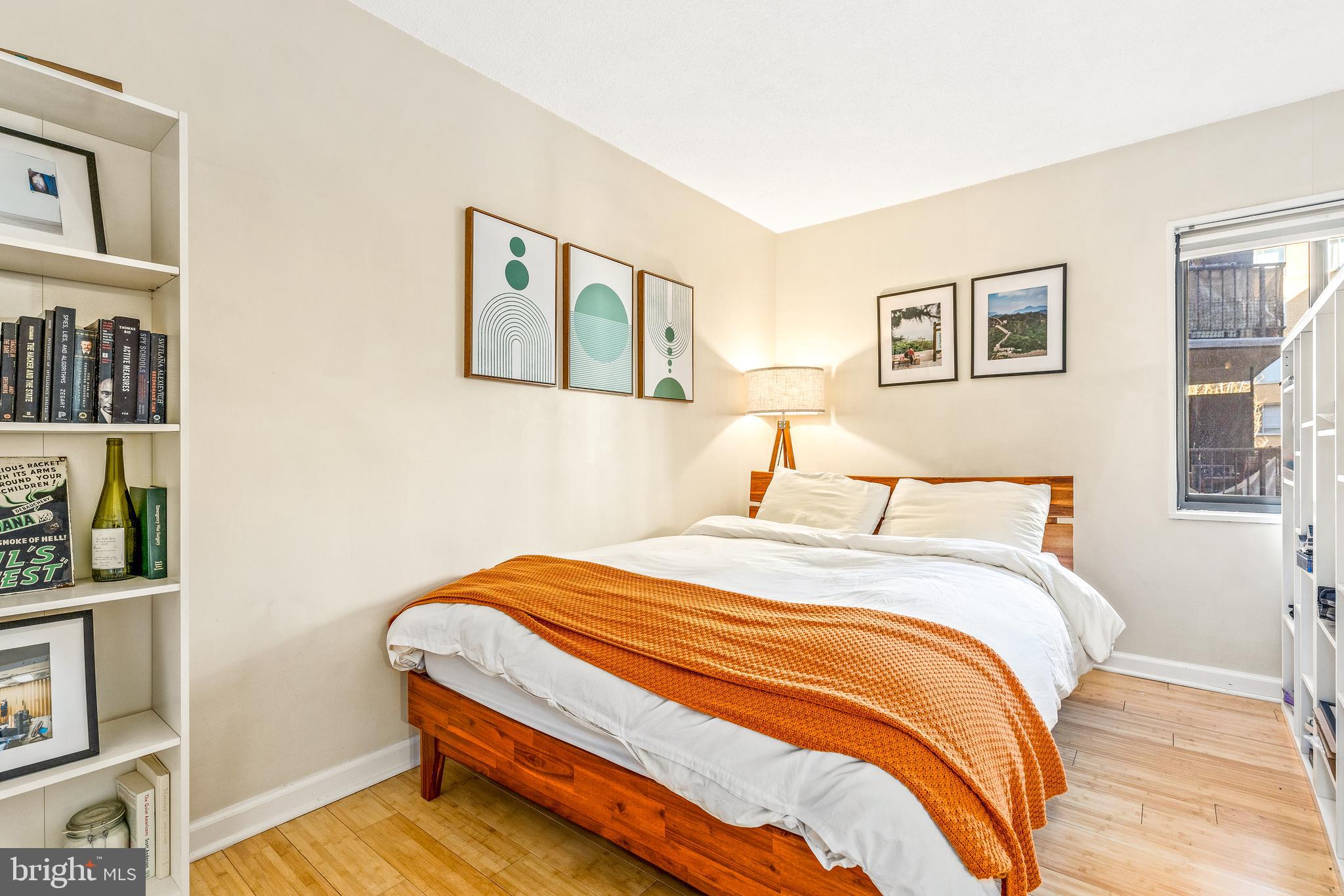 1718 P Street Northwest, Unit 509 Washington, DC 20036 - Photo 12 of 20 a bedroom with bed and wooden floor
