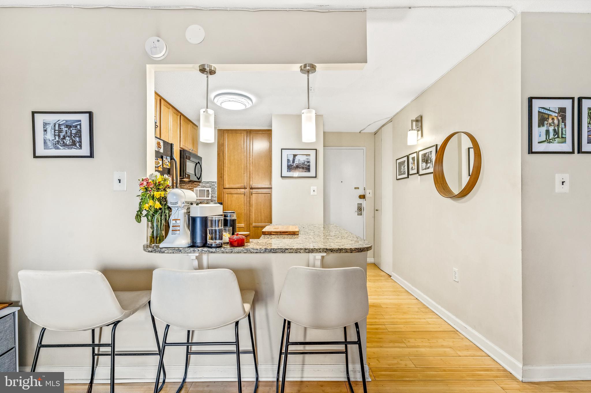 1718 P Street Northwest, Unit 509 Washington, DC 20036 - Photo 2 of 20 a dining room with furniture and a mirror