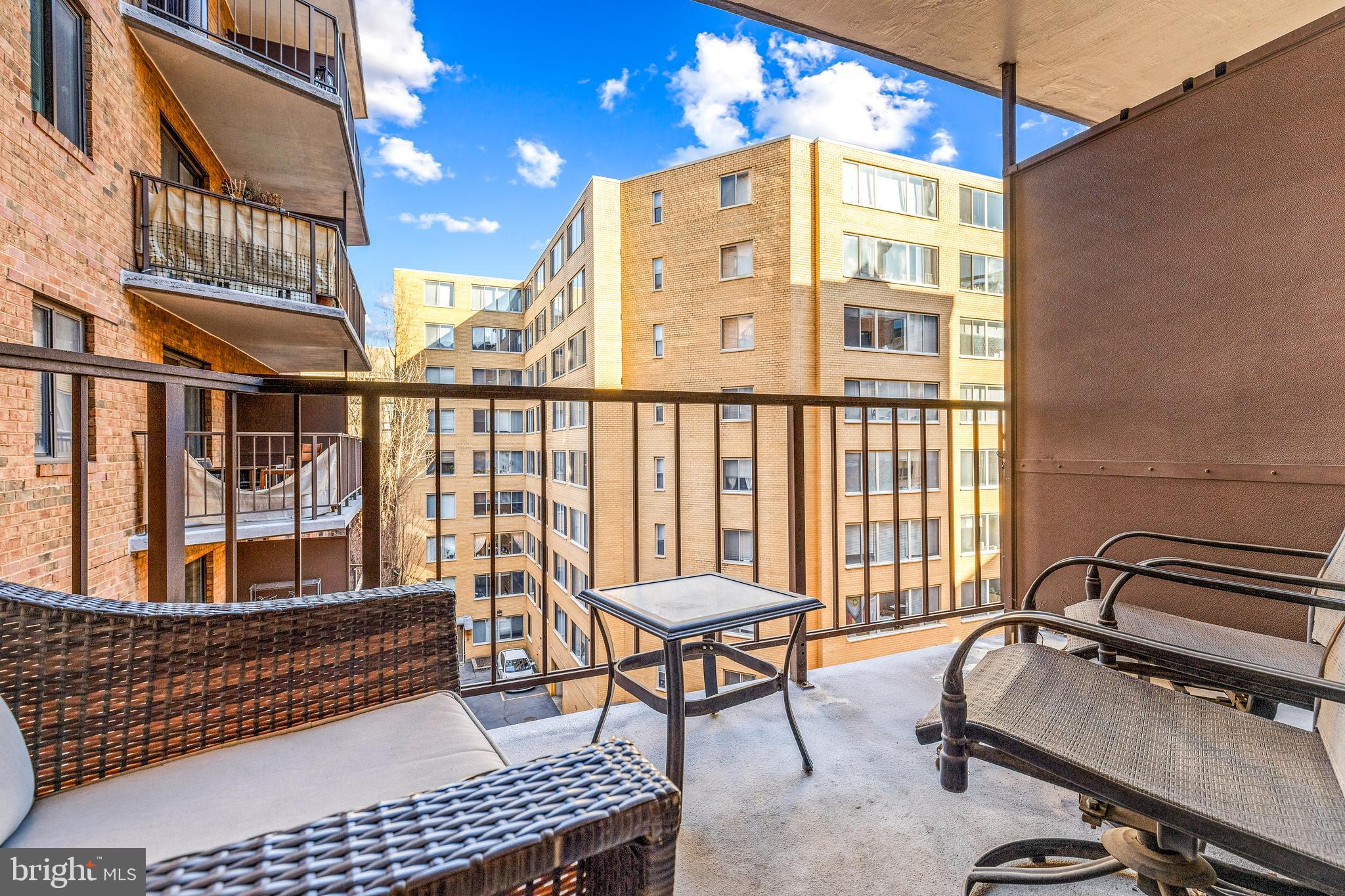 1718 P Street Northwest, Unit 509 Washington, DC 20036 - Photo 10 of 20 a balcony with chairs and a potted plant