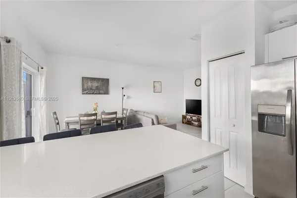 a kitchen with a sink cabinets and window
