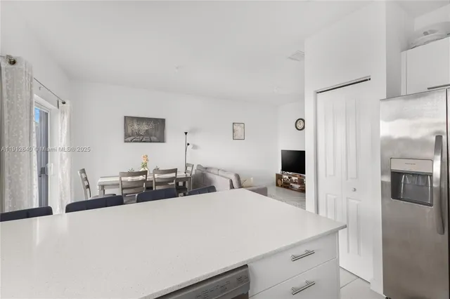 a kitchen with a sink cabinets and window