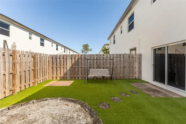 a backyard with a garden and plants