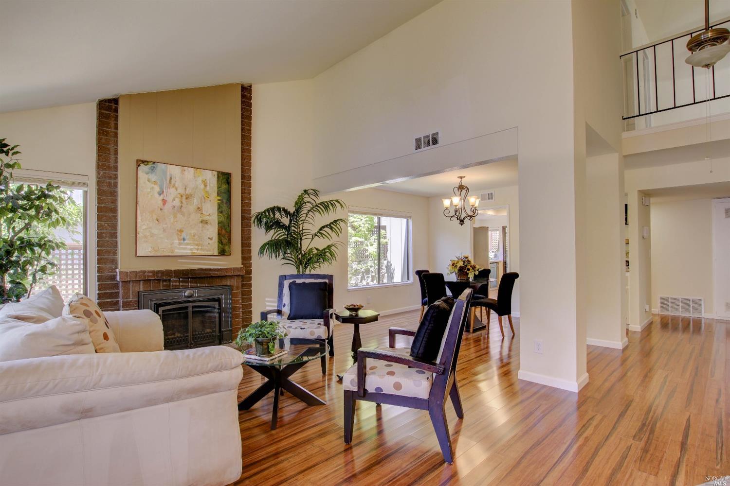 4 Chapparal Court Novato, CA 94949 - Photo 1 of 1 a living room with furniture a large window and wooden floor