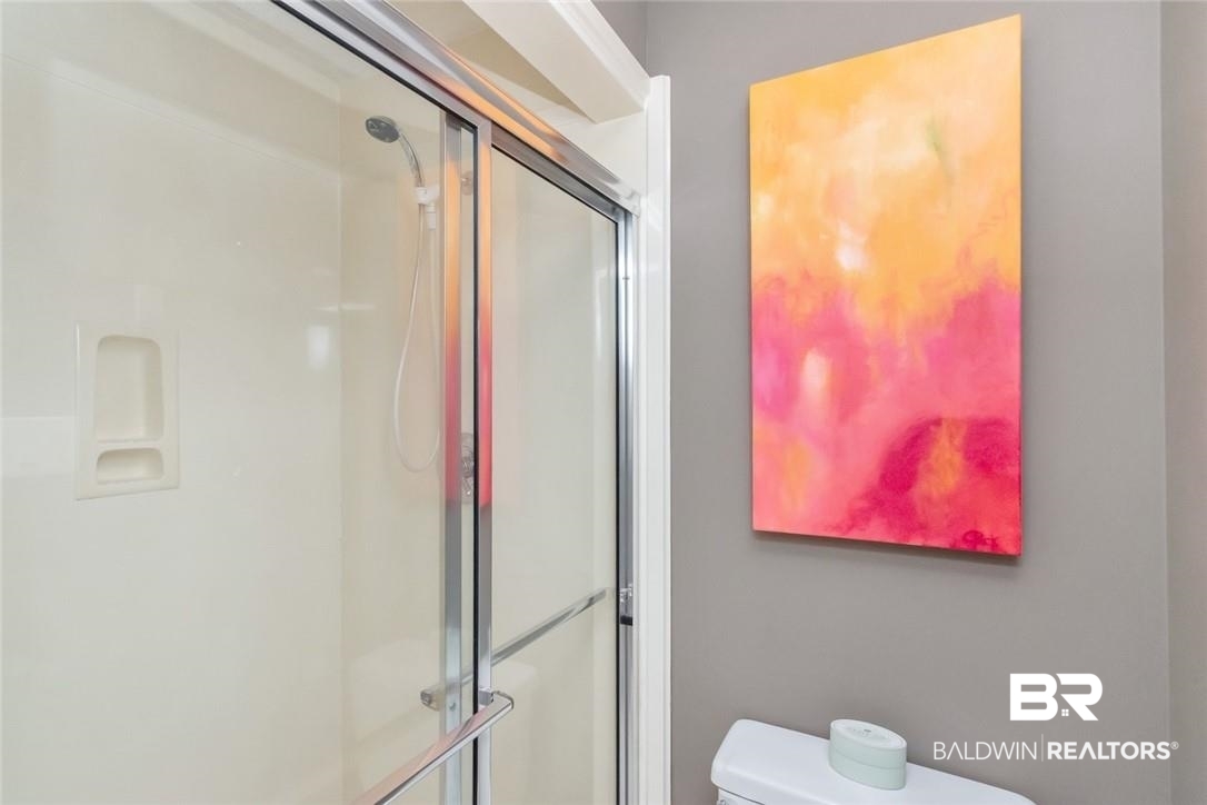 305 Fern Hill Court Mobile, AL 36608 - Photo 35 of 53 Bathroom featuring a shower with door and toilet