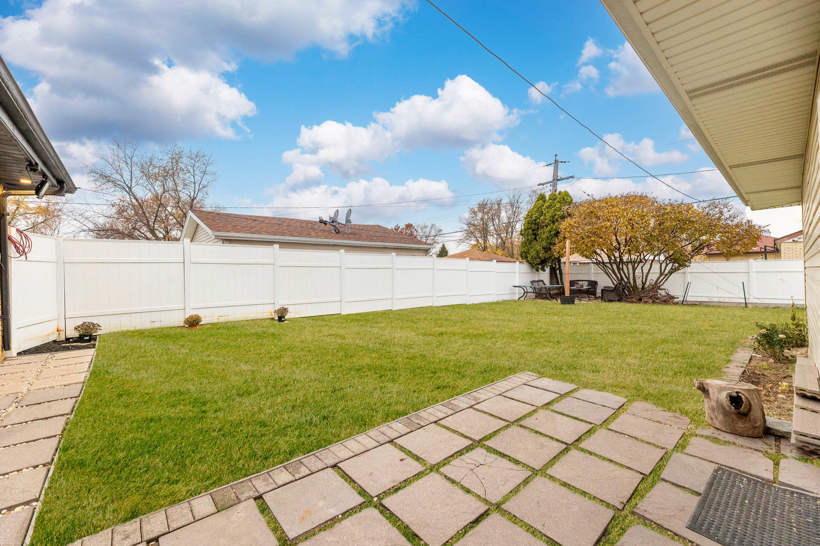 7656 80th Place Bridgeview, IL 60455 - Photo 17 of 39 a view of a backyard with sitting area