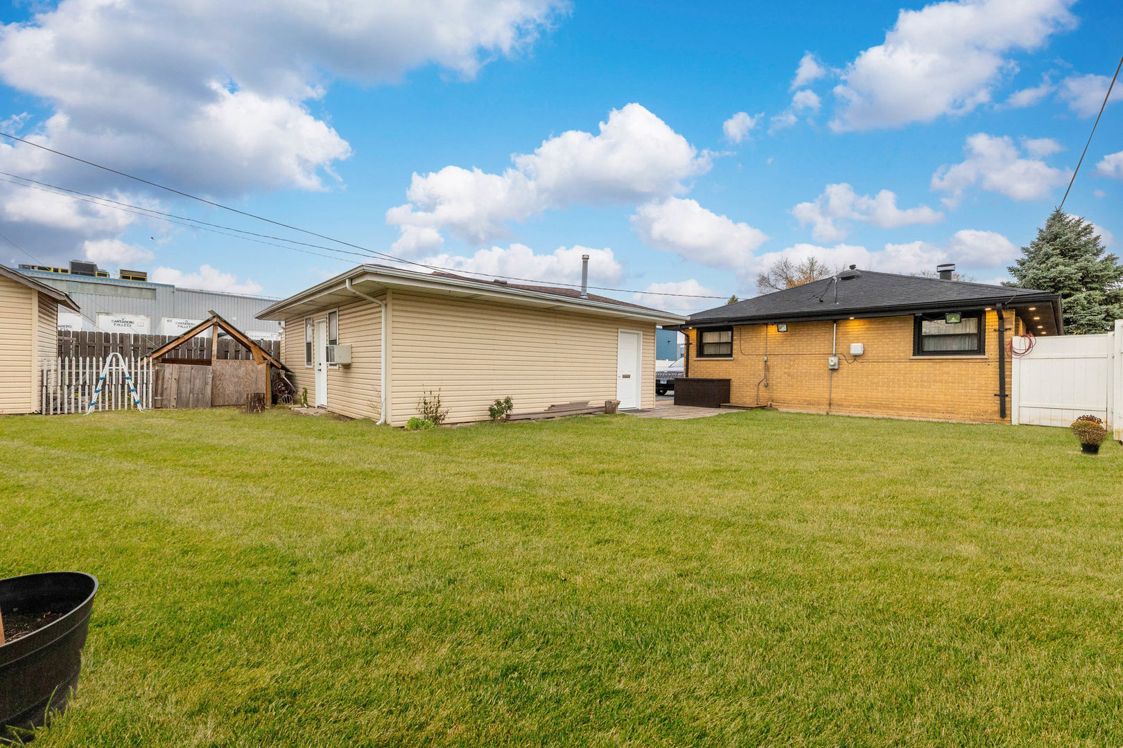 7656 80th Place Bridgeview, IL 60455 - Photo 18 of 39 a house view with swimming pool and garden