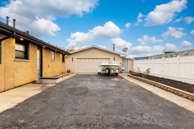 a view of a car park in front of house